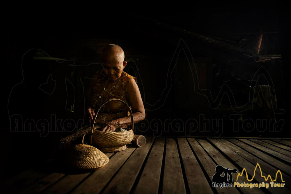 Elderly helper at pagoda cambodia photography